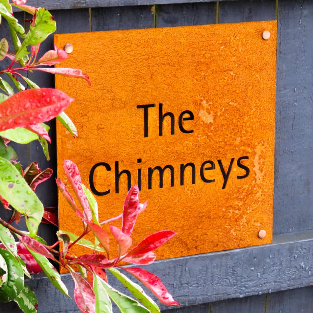 a corten house sign